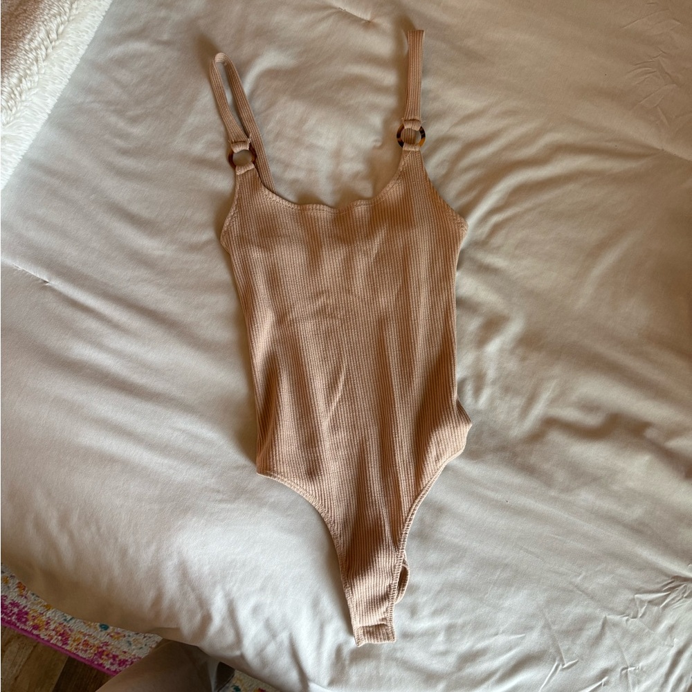 Tan small body suit